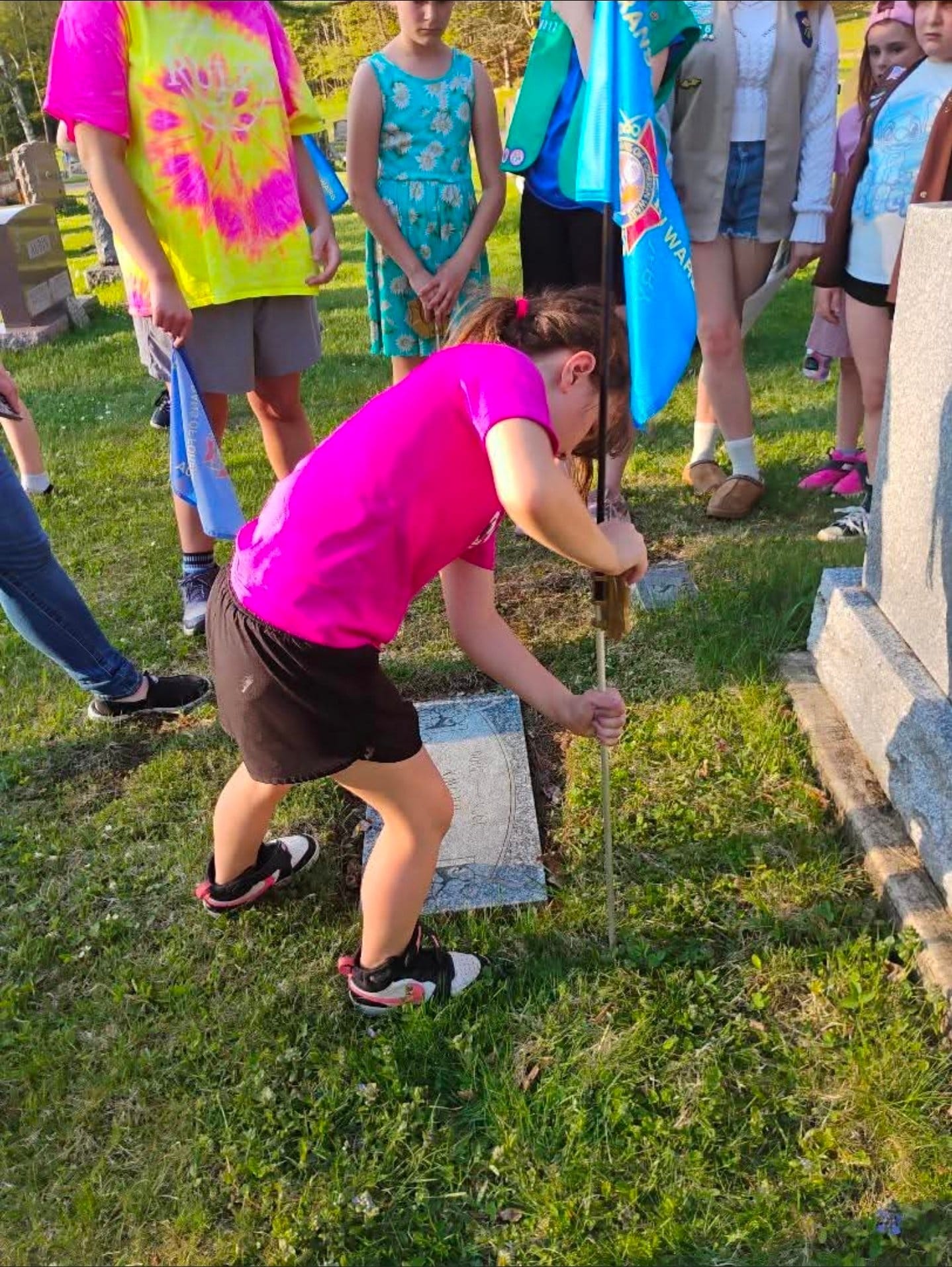 Flag placement at Pine Ridge Cemetery